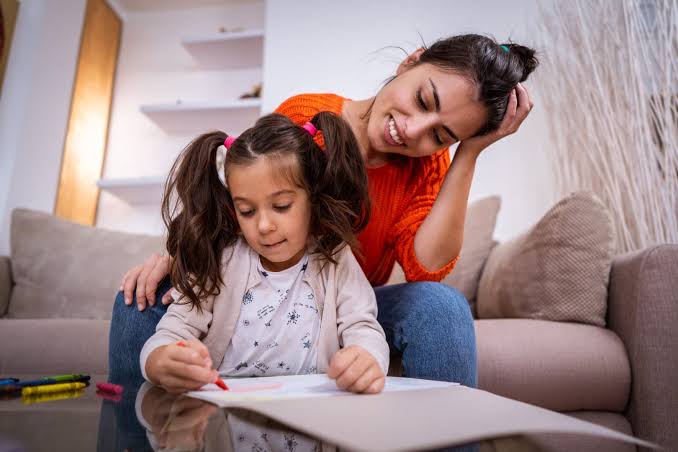Caring nanny taking care of child